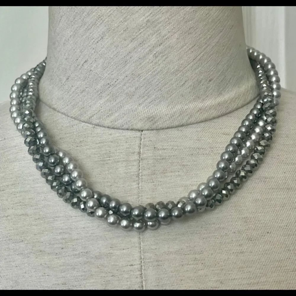 The Roman company Tri strand gray necklace